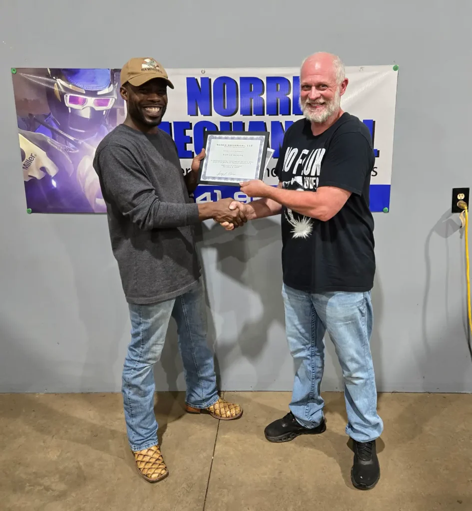 Jerry handing welding certificate